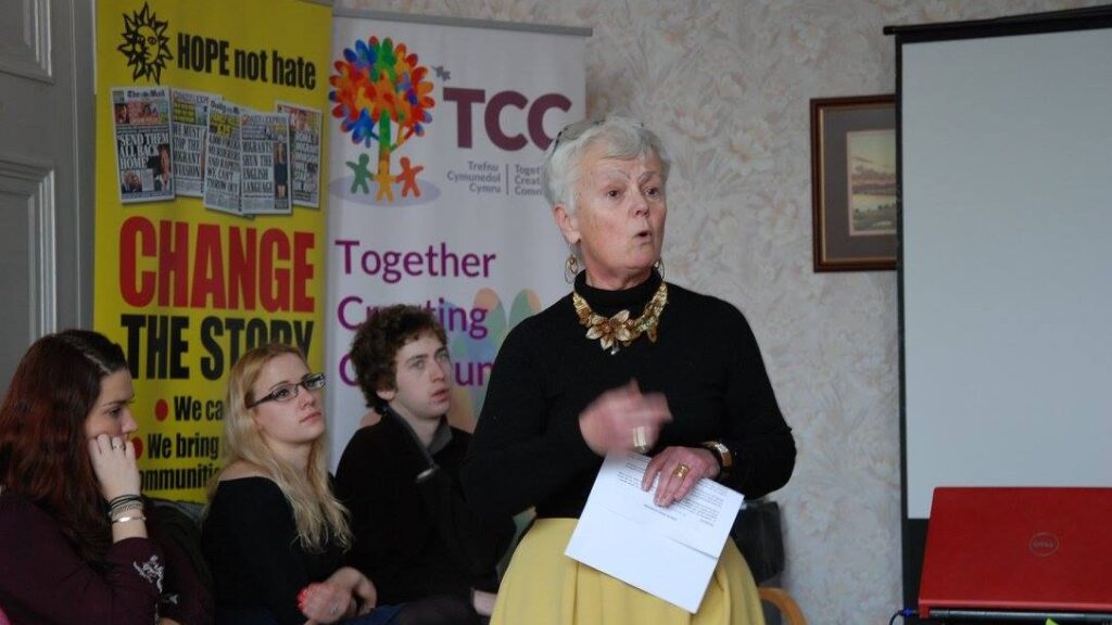 Image of TCC Founder Nia Higginbotham addressing a community group