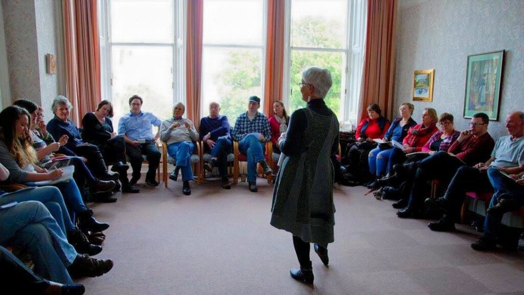 Nia Higginbotham leading a community discussion.